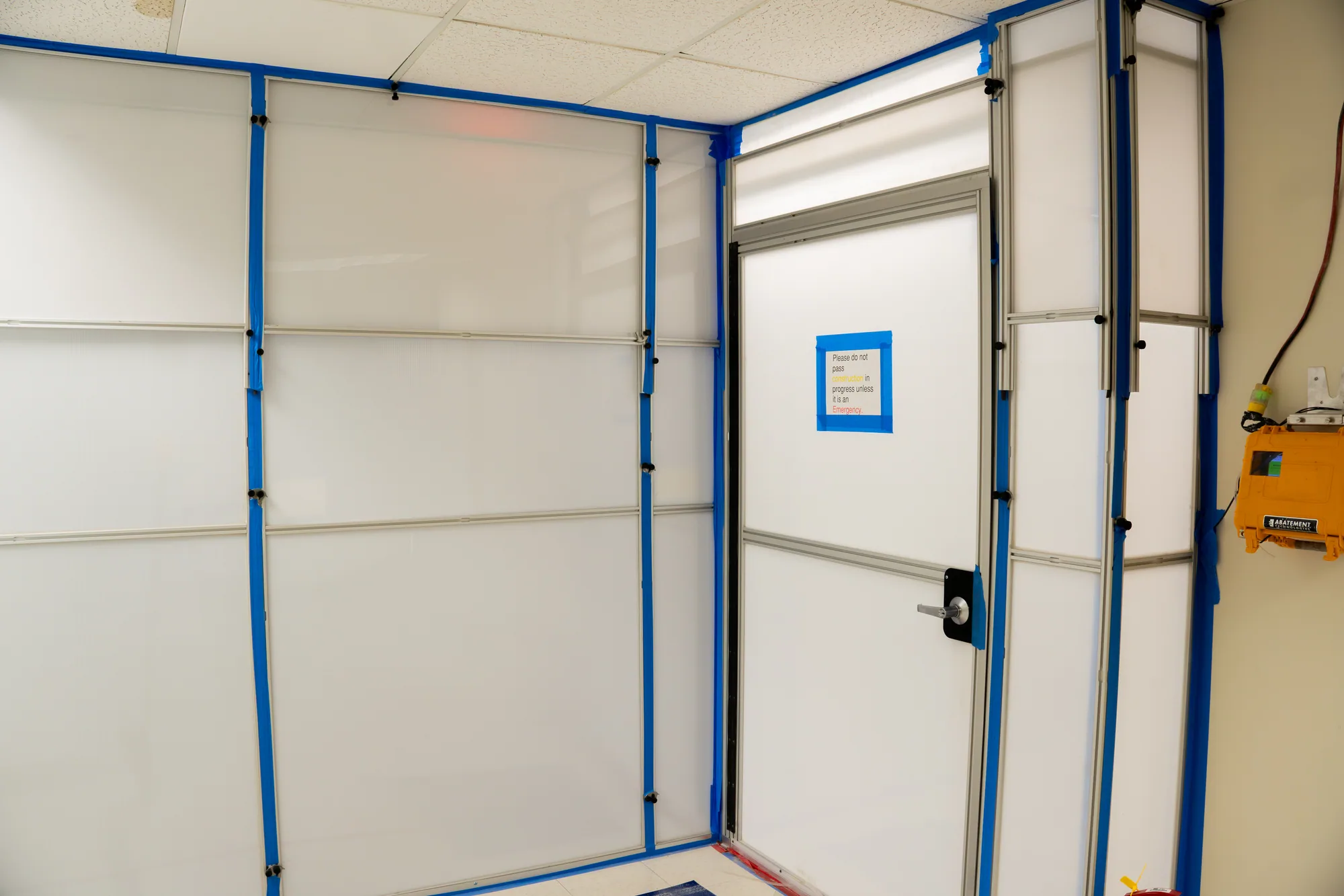 Temporary containment wall and controlled access door at MOB Pompano